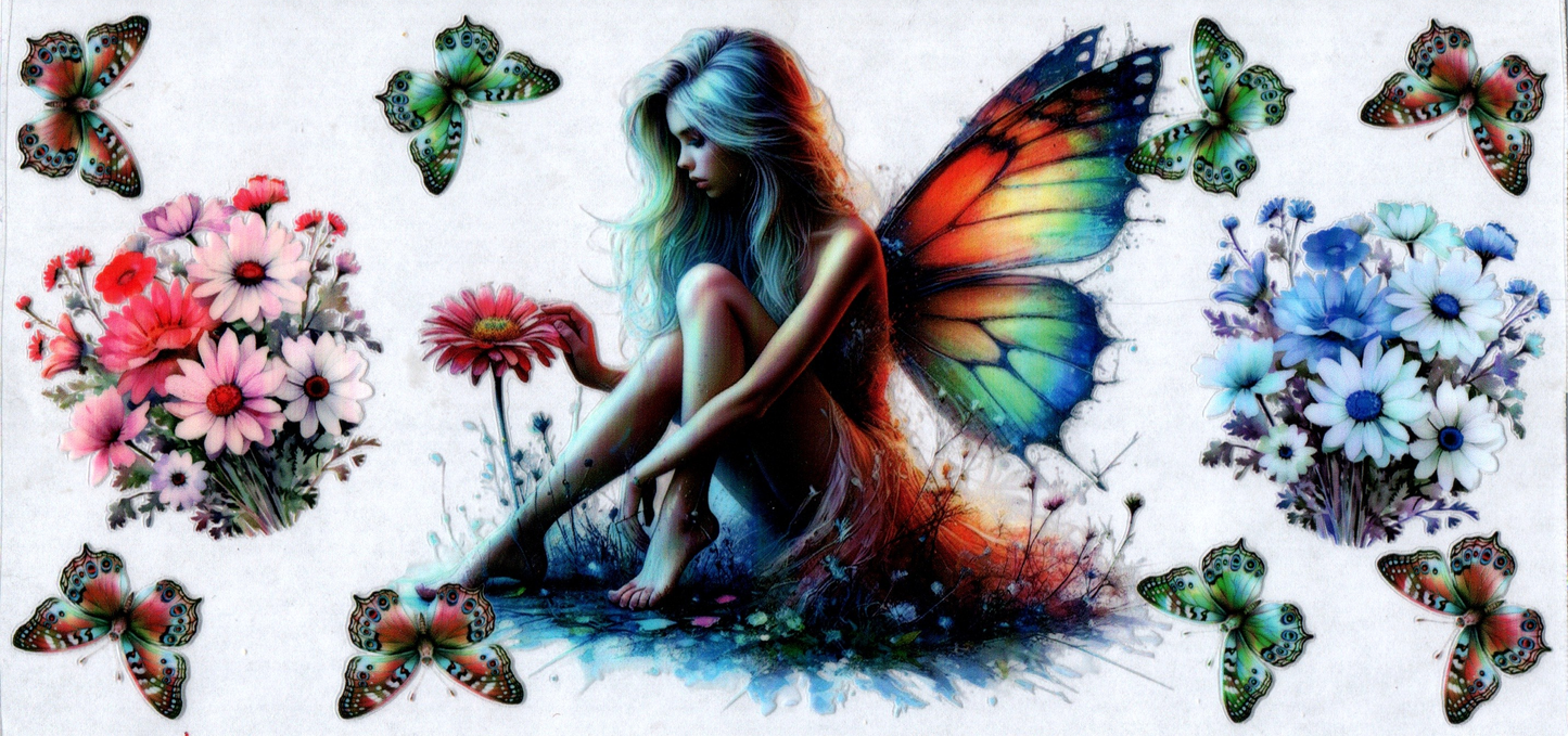 16 oz Rainbow winged fairy sitting with flowers